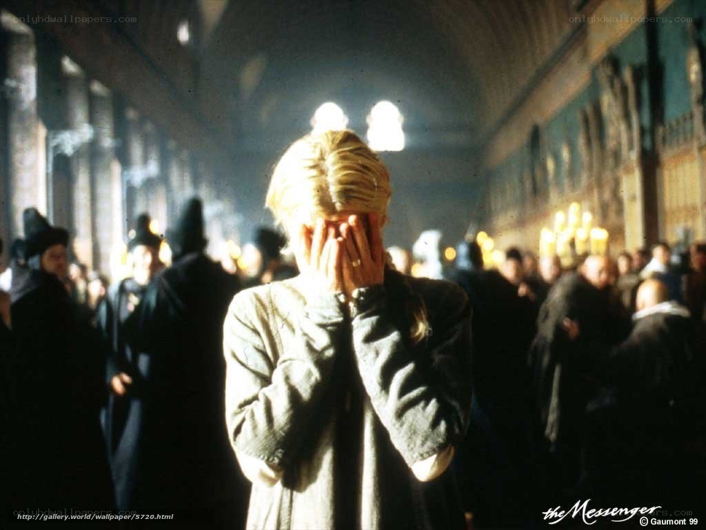 woman covering face in crowd