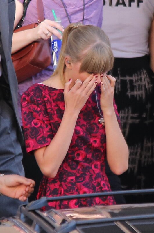 woman covering face in public