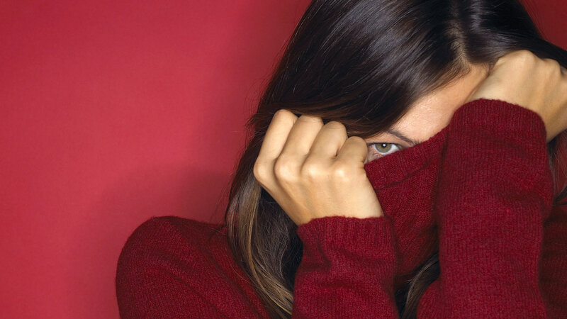 Woman Covering Face — Red