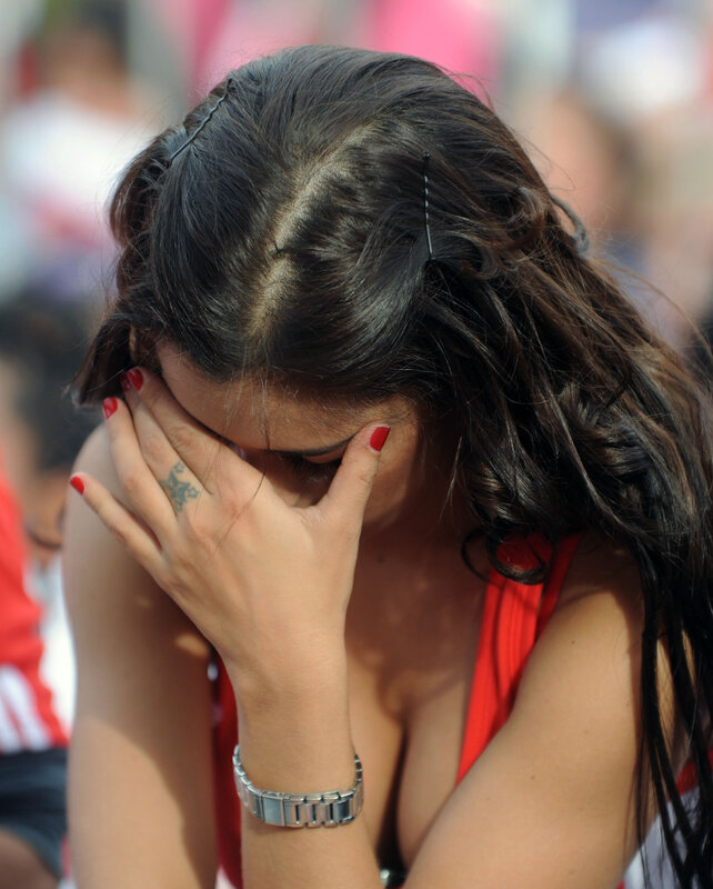 woman covering face with hand