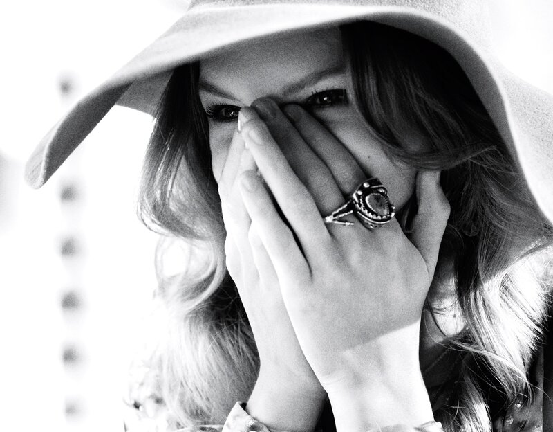 woman covering face with hands
