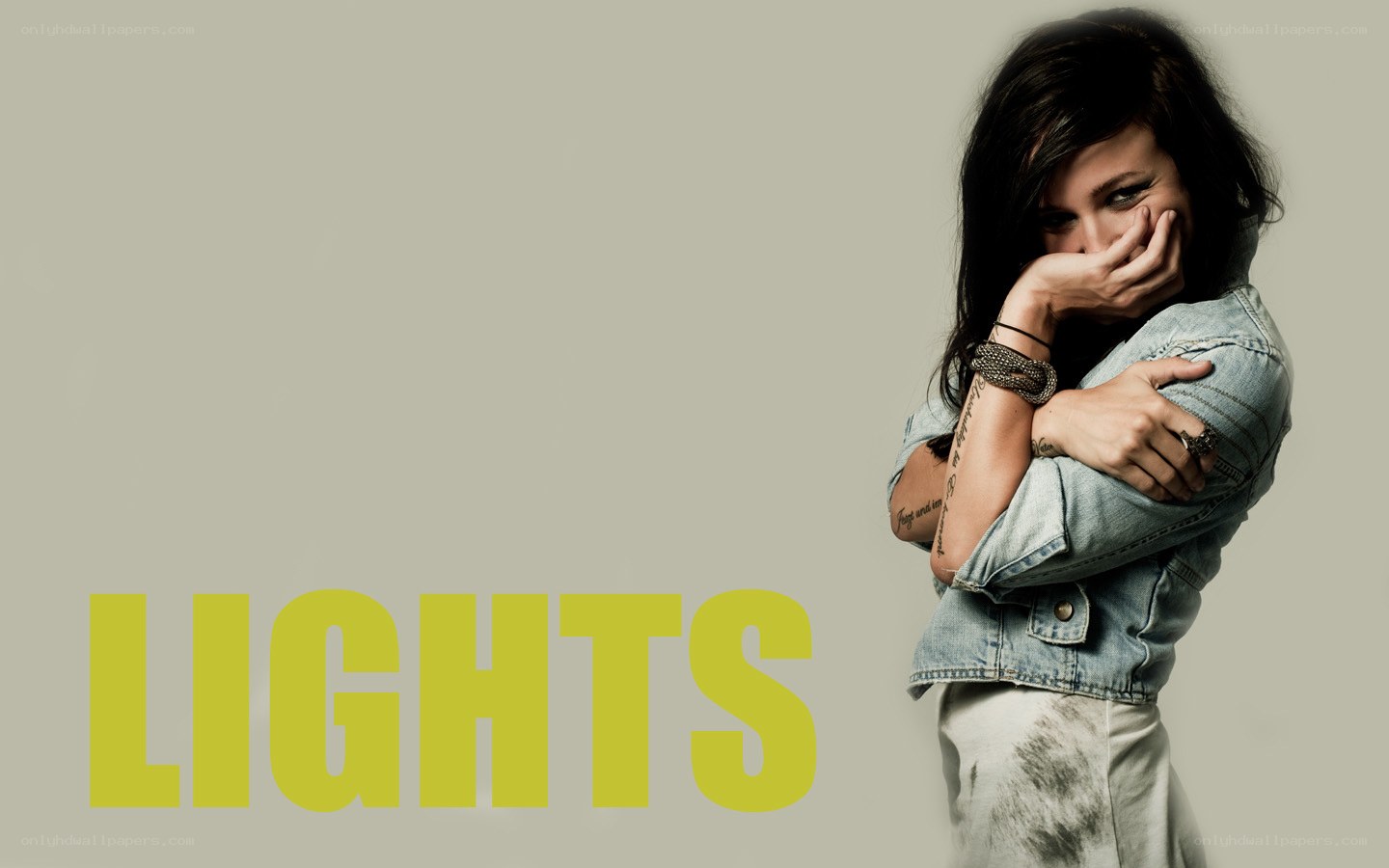 woman covering face with text lights
