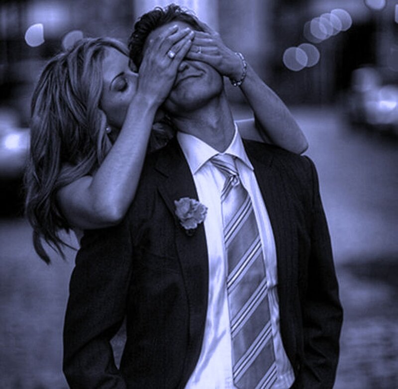 Woman Covering Man's Eyes