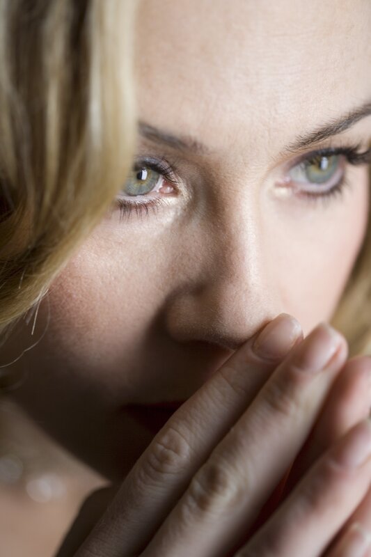 Woman Covering Mouth — Beige, Dramatic