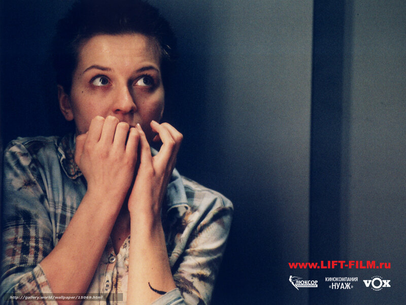 woman covering mouth in fear