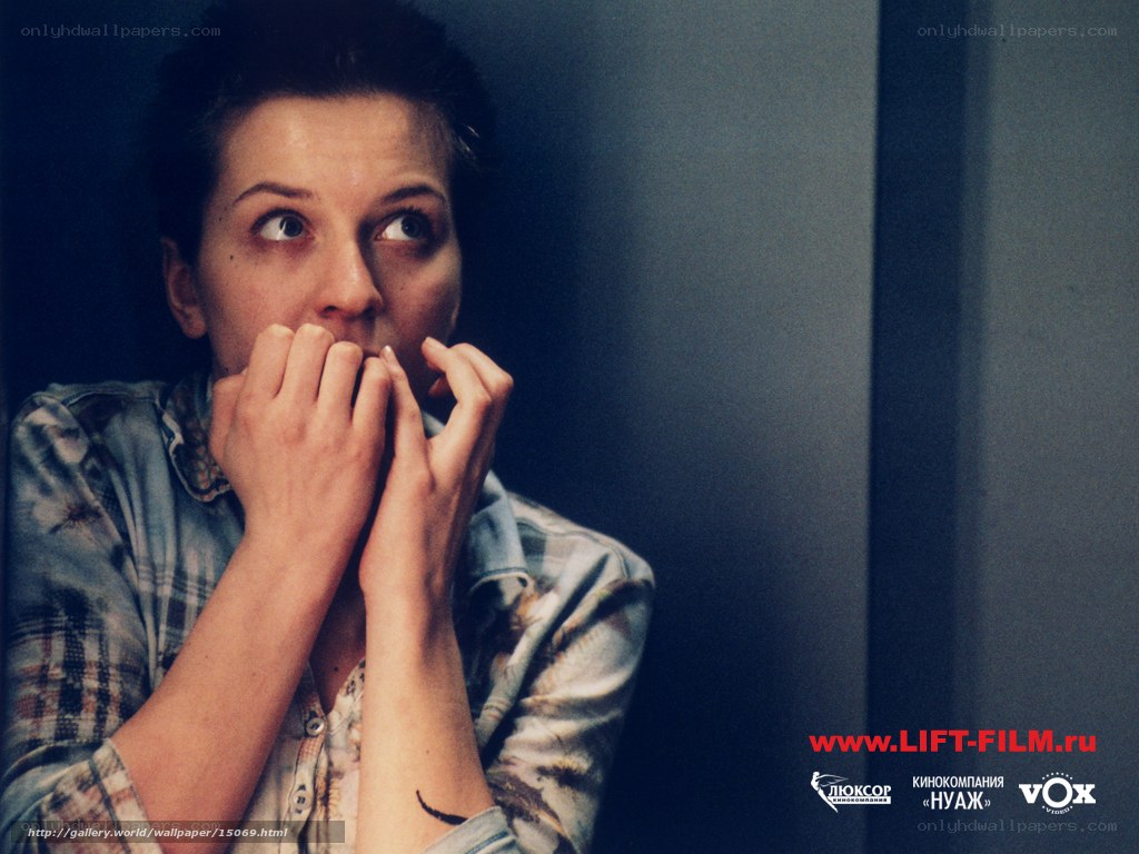 woman covering mouth in fear