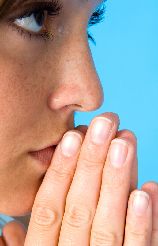 woman covering mouth with hand