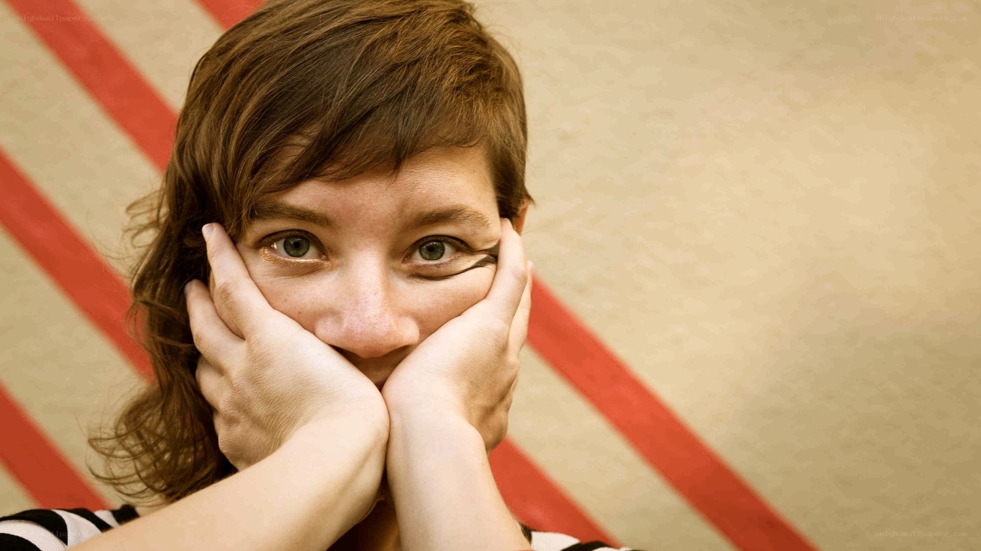 woman covering mouth with hands