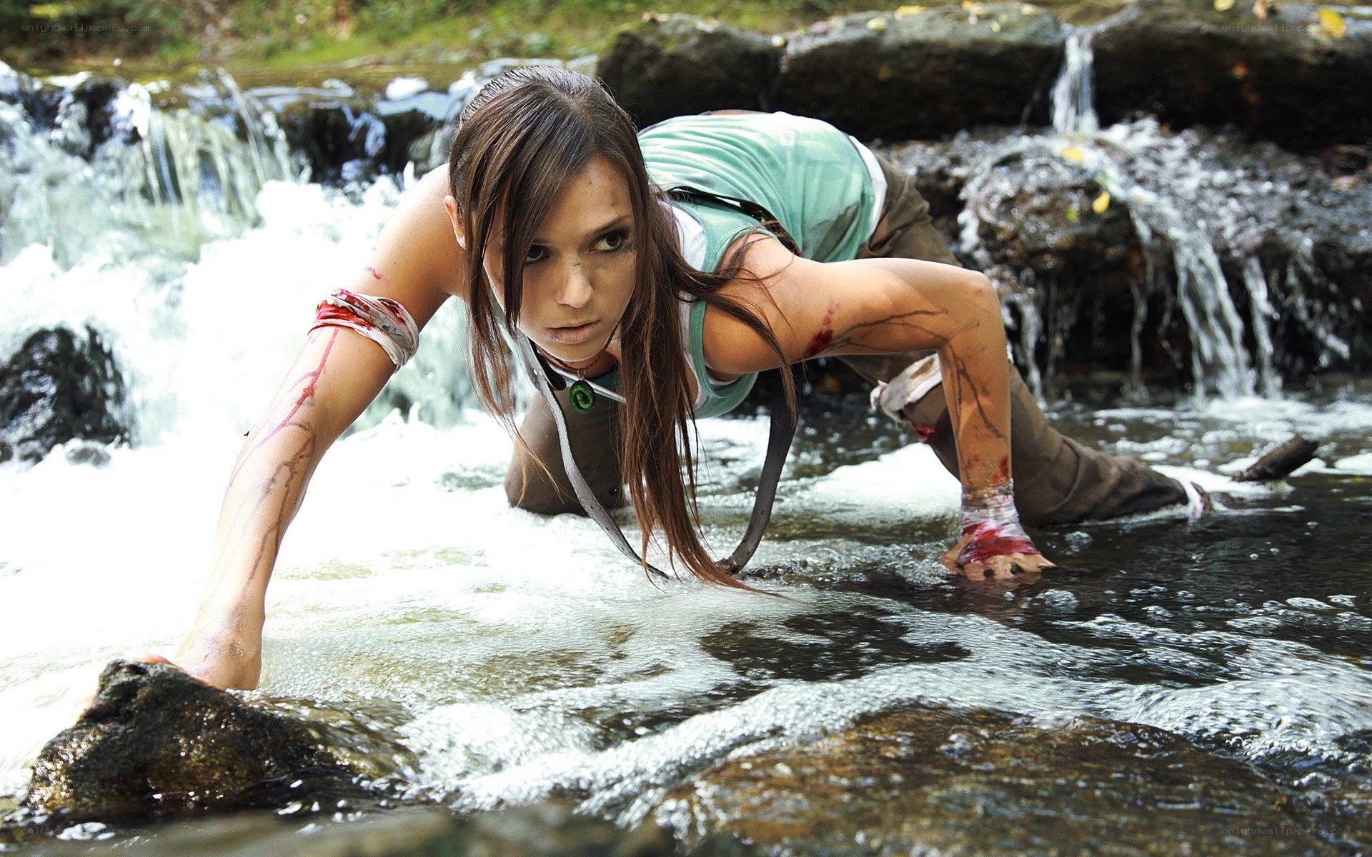 Woman crawling in a stream