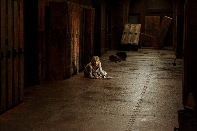 woman crawling in dark corridor