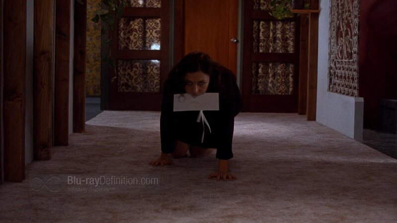 woman crawling with gagged mouth