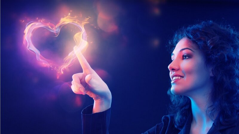 woman creating a heart of light