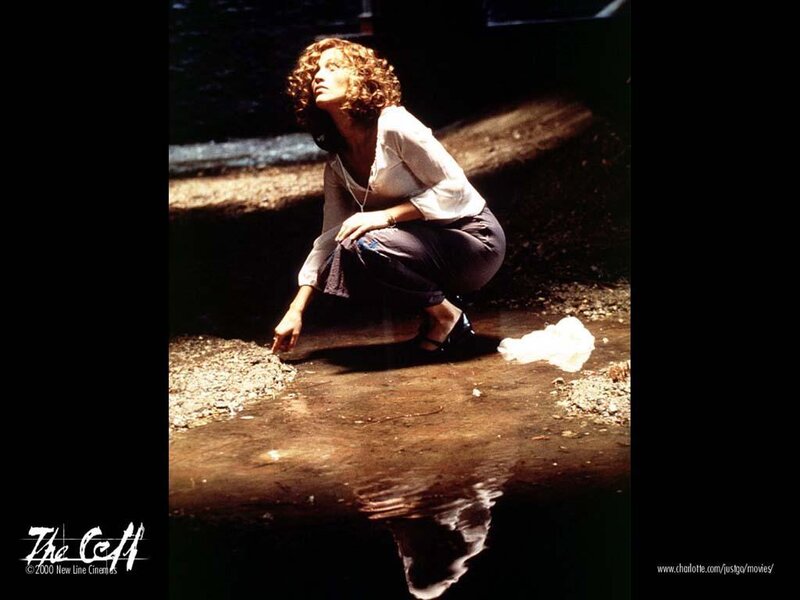 Woman Crouching by Water