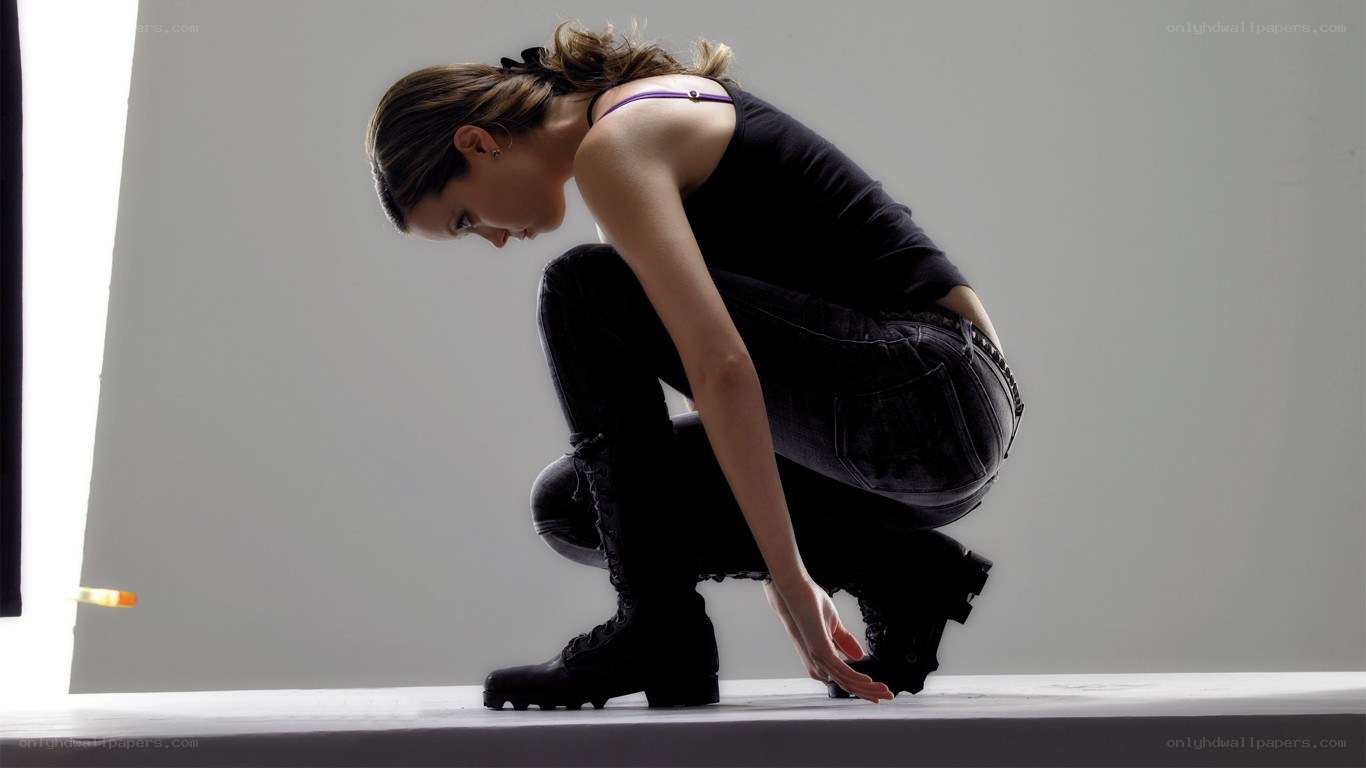 woman crouching in studio