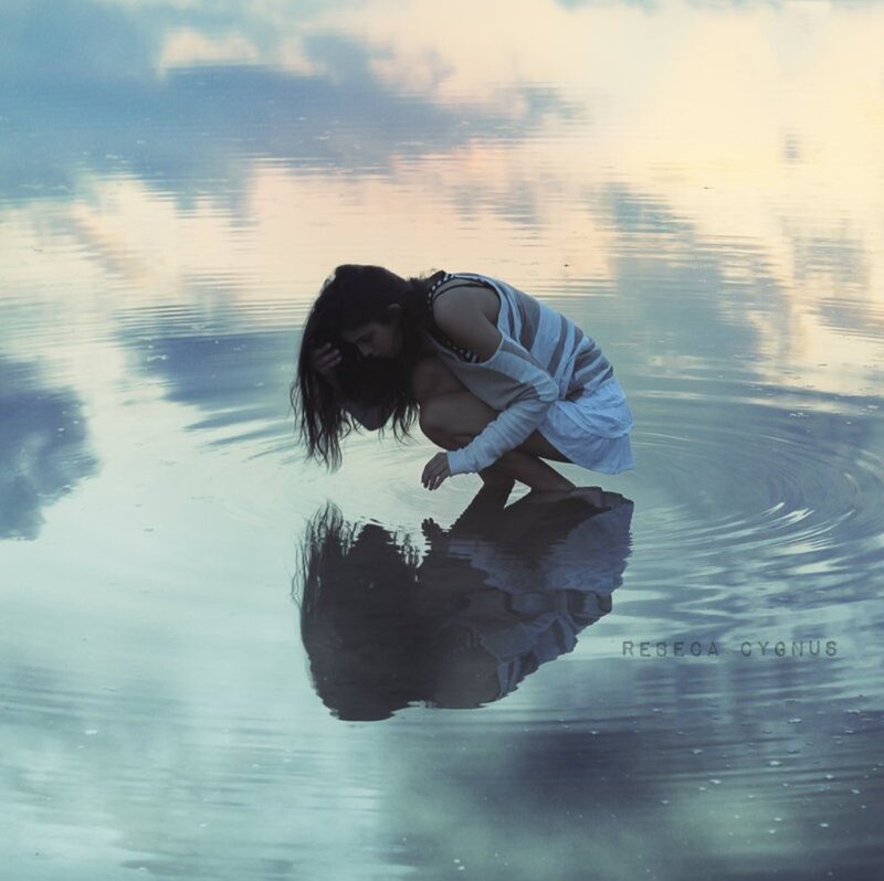 Woman Crouching in Water — Blue