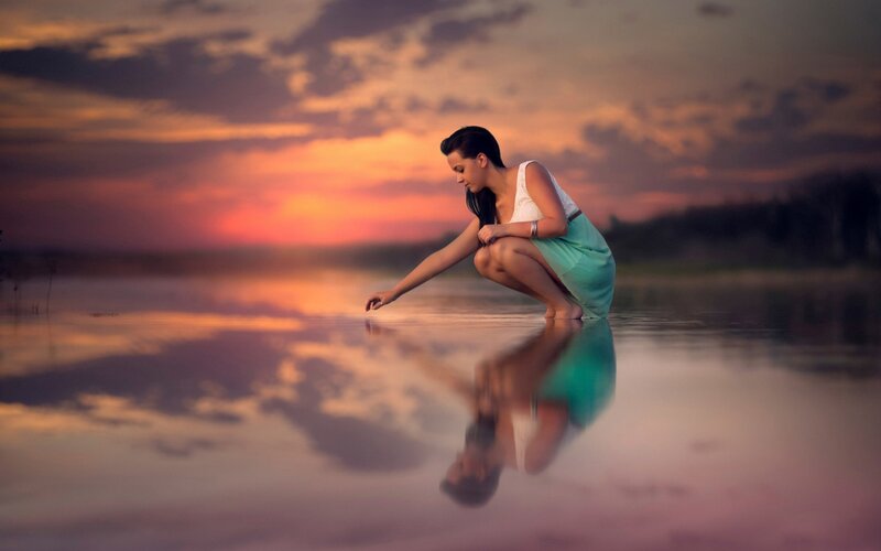Woman Crouching in Water — Orange