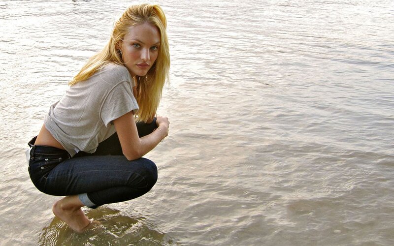 woman crouching in water
