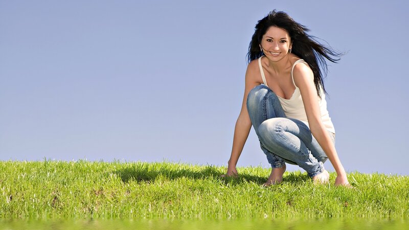 Woman Crouching on Grass — Green
