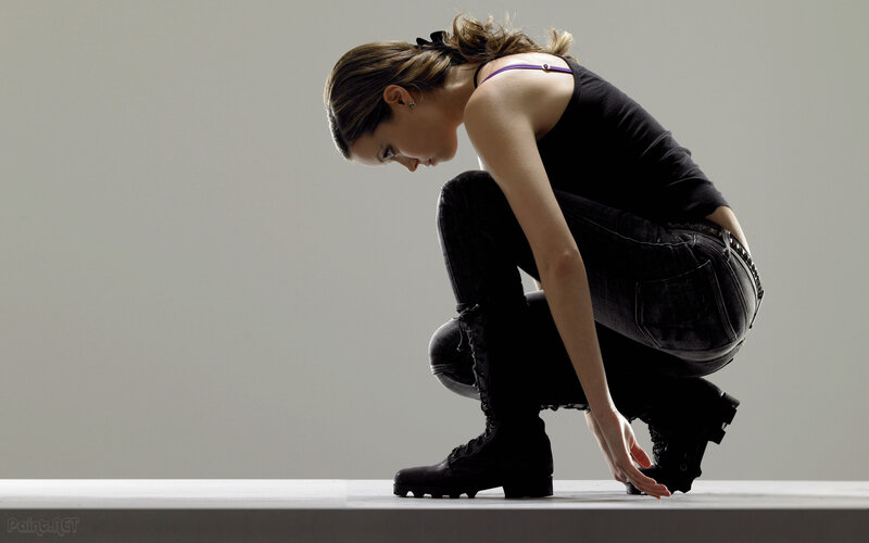 woman crouching on platform