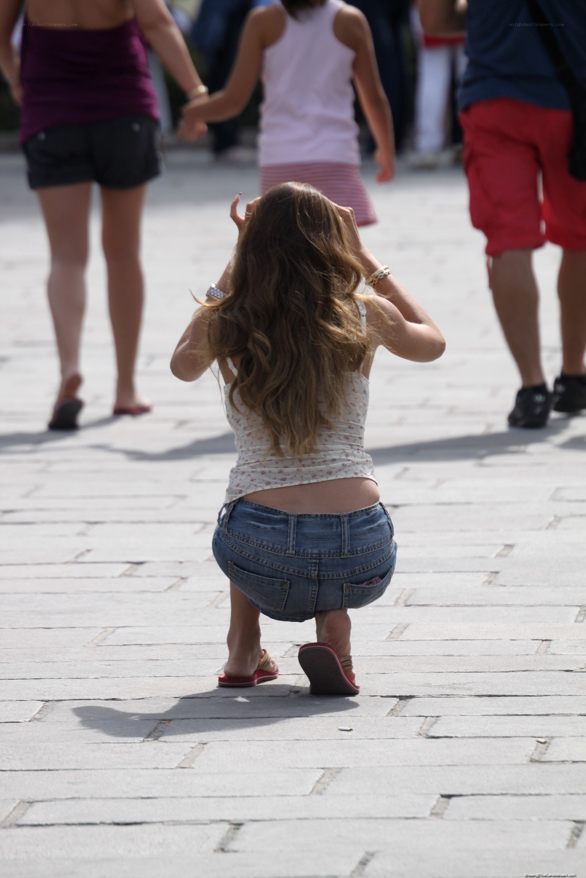 Woman crouching on street