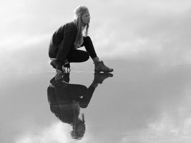 Woman Crouching on Water