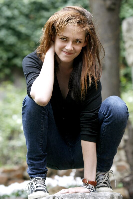 woman crouching outdoors