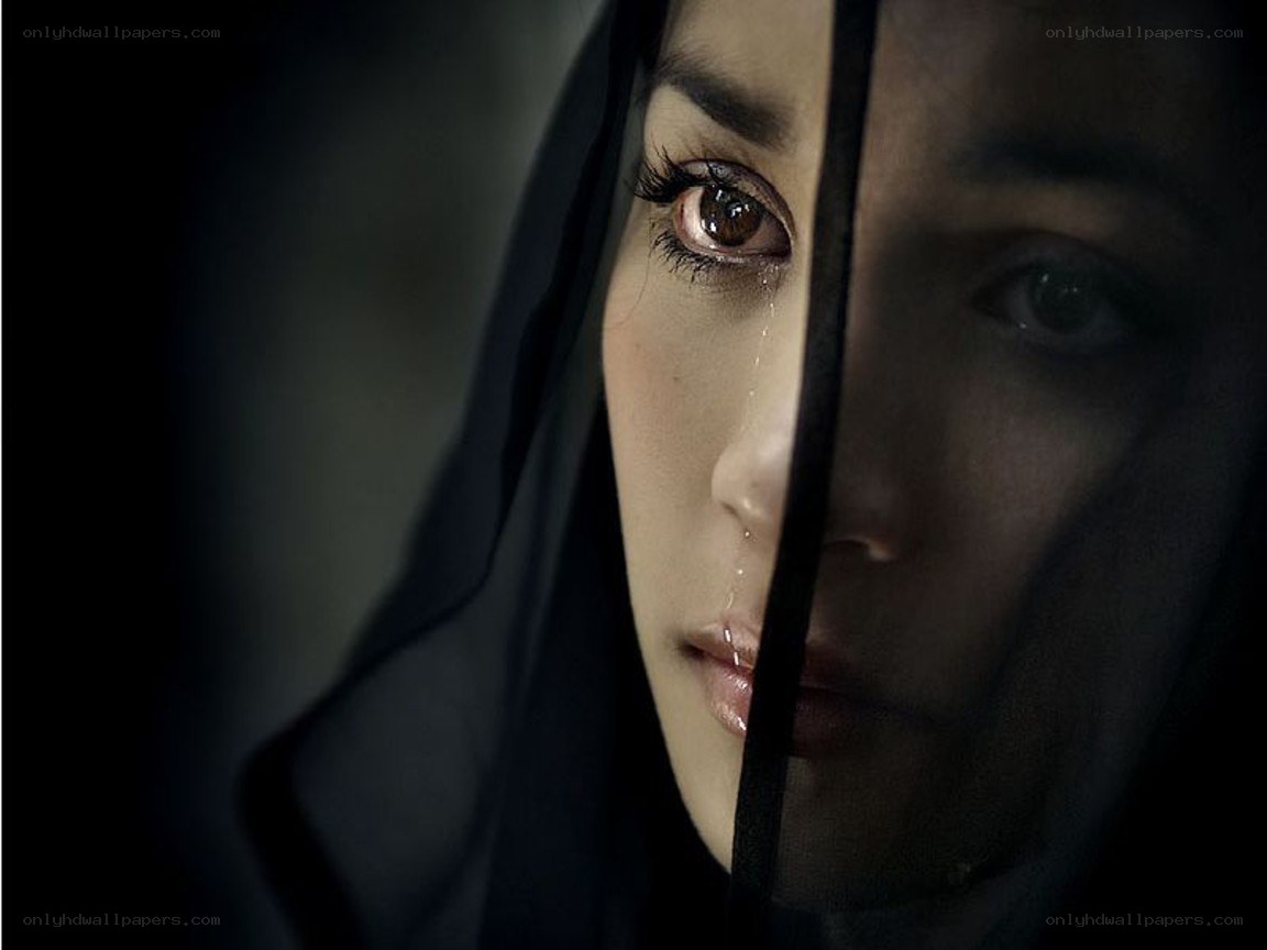 woman crying behind veil