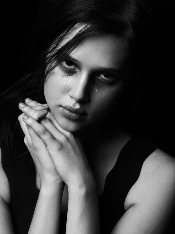 woman crying in black and white