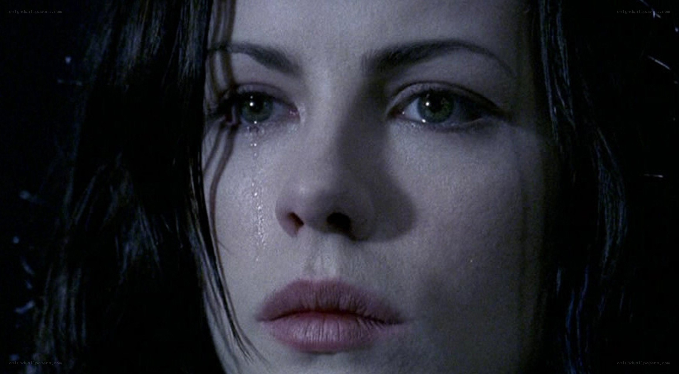 woman crying in dark