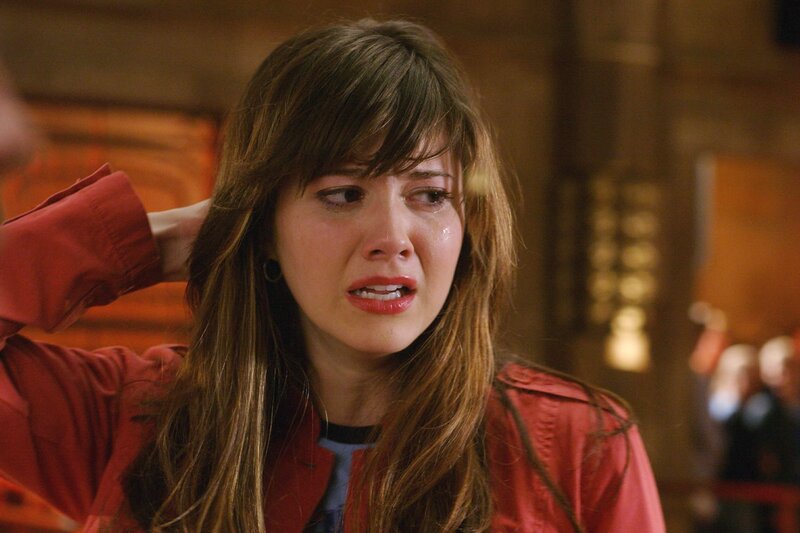 woman crying in red jacket