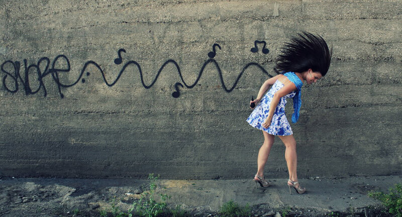 Woman Dancing Against Wall