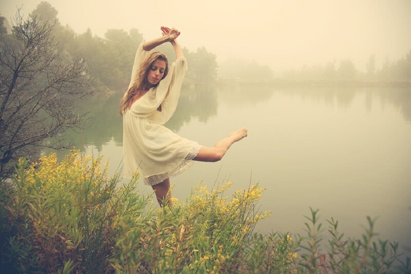 Woman Dancing by Lake