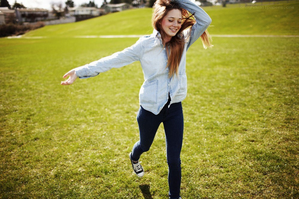 woman dancing in a field
