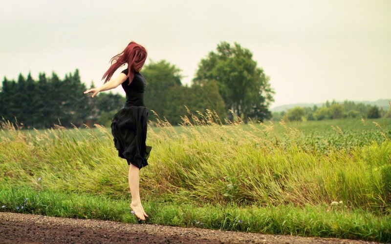 woman dancing in a field