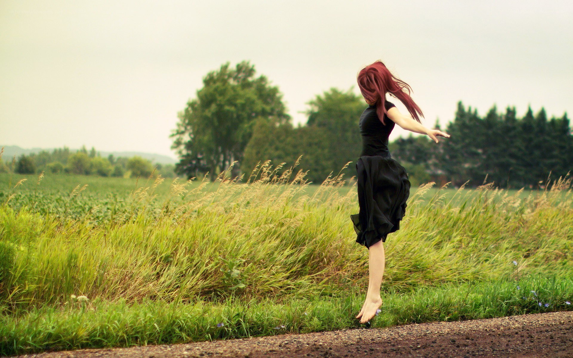 woman dancing in a field