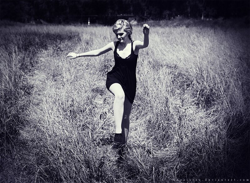woman dancing in a field