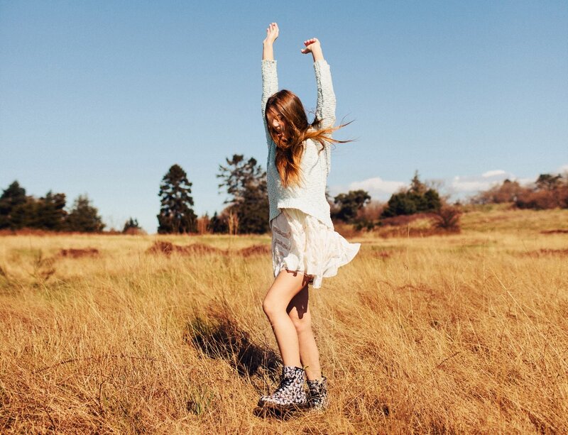 Woman dancing in a field