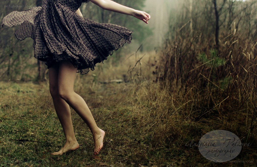 woman dancing in a forest