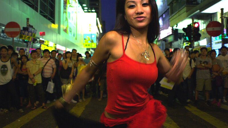 Woman dancing in city street