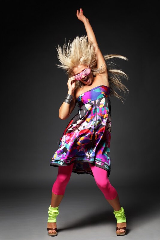 woman dancing in colorful outfit