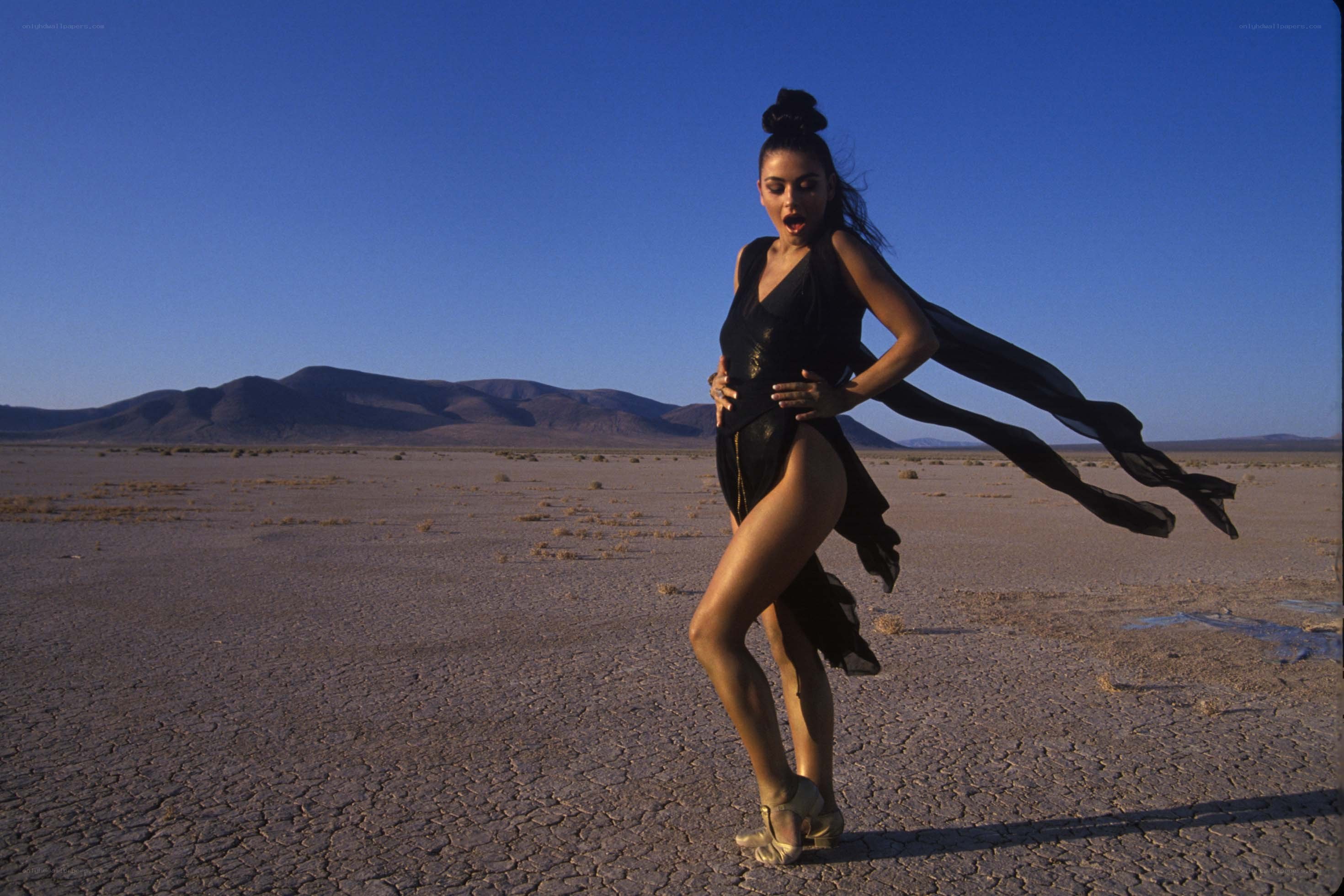 Woman dancing in desert