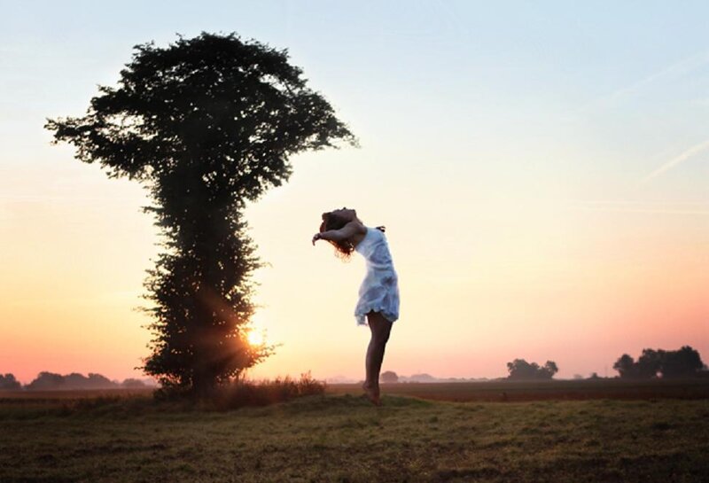 Woman Dancing in Field — Orange