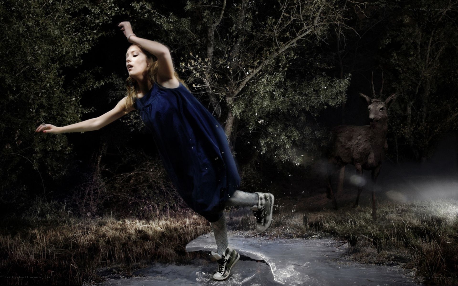 woman dancing in forest at night
