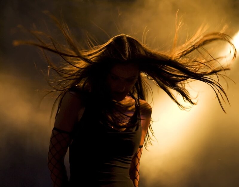 woman dancing in golden light