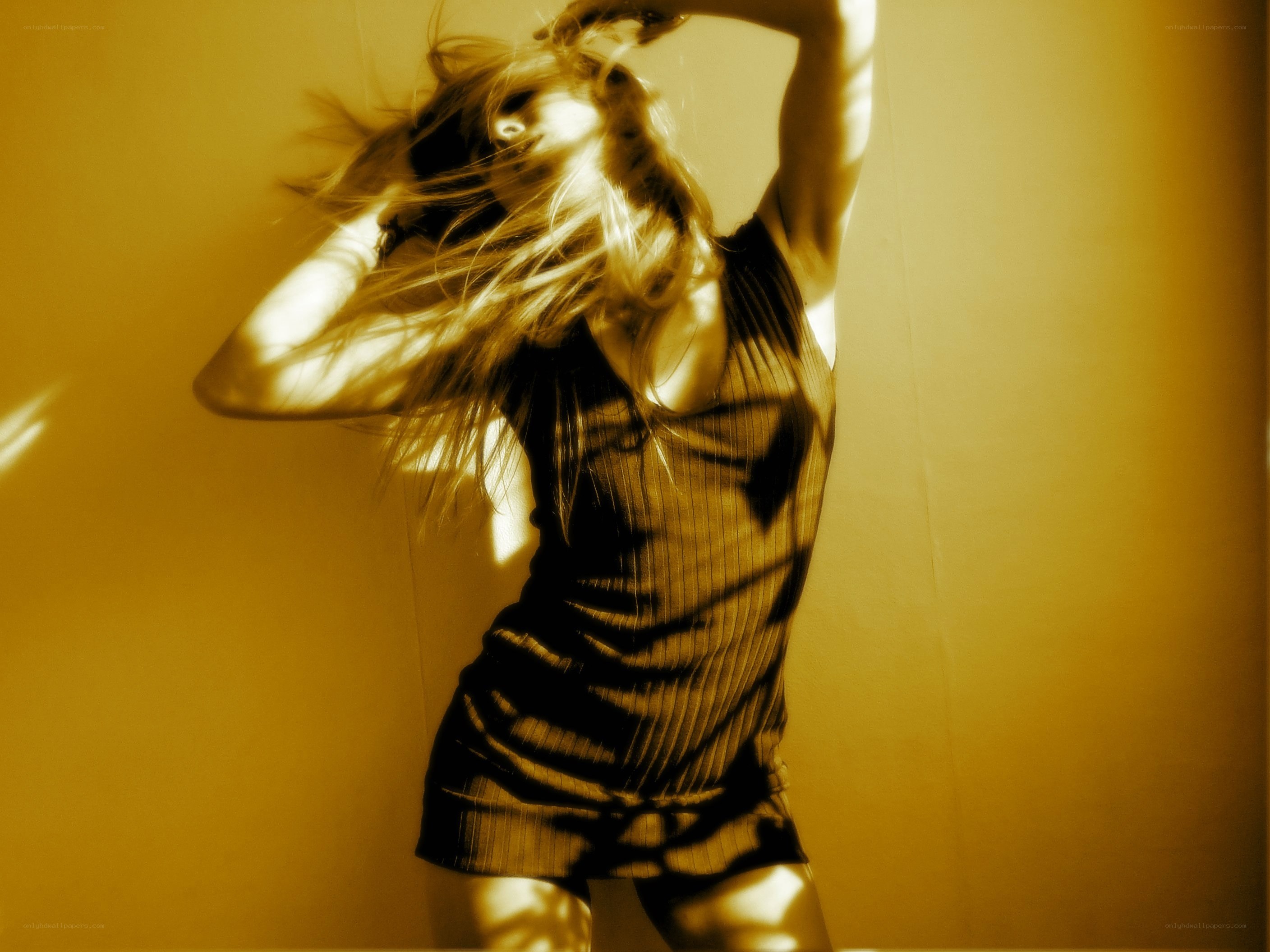 woman dancing in golden light