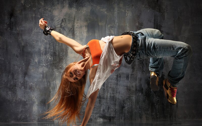 Woman Dancing in Midair — Orange, Dynamic, Photograph