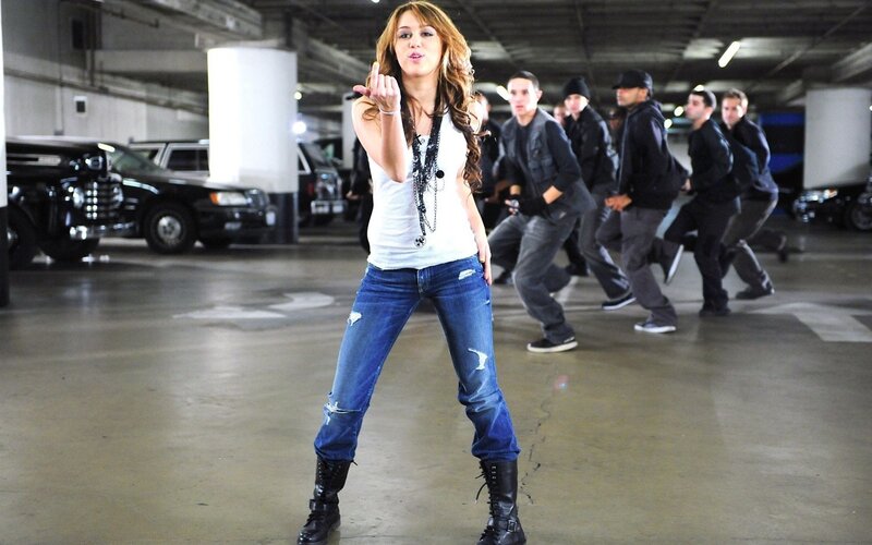 woman dancing in parking garage