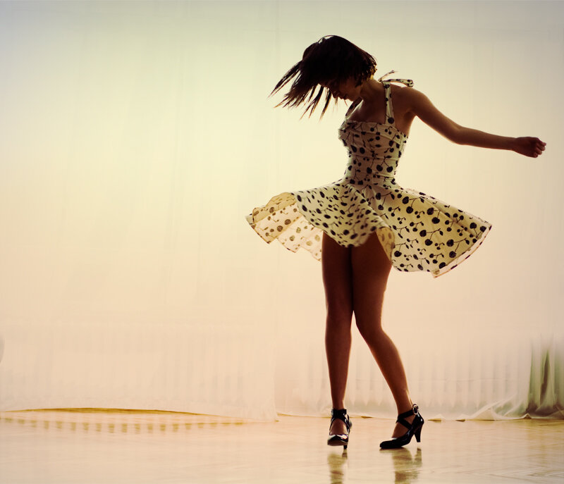 woman dancing in polka dot dress