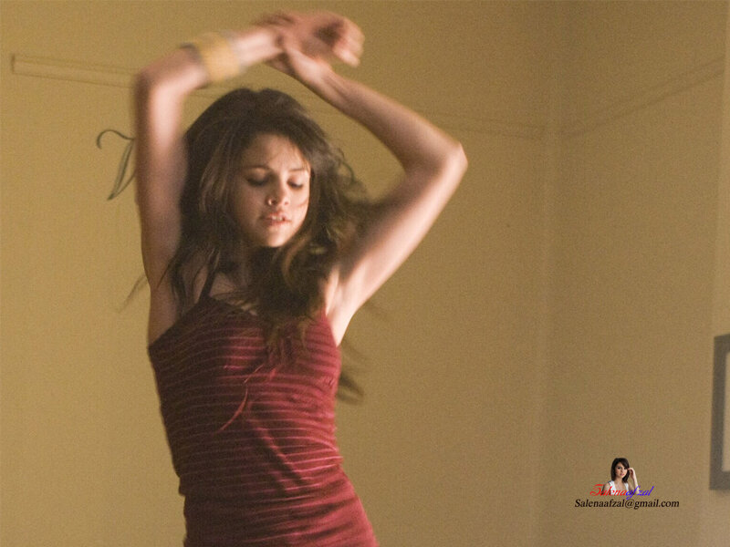 woman dancing in red top