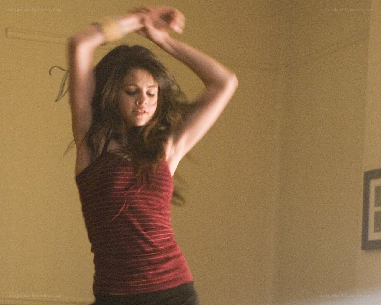 woman dancing in red top